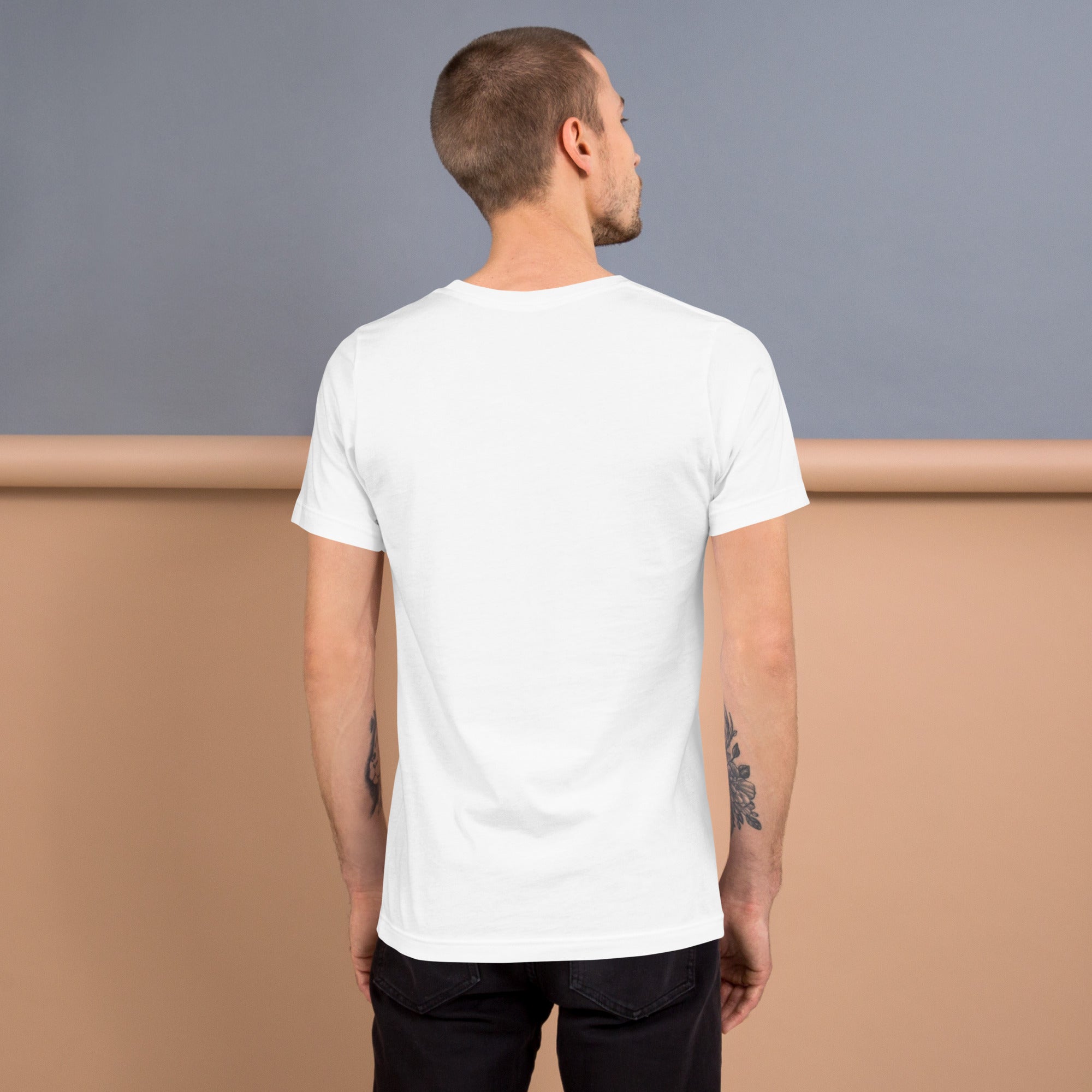 Back view of a man wearing a Unisex T shirt, showcasing its casual style and soft cotton fabric.