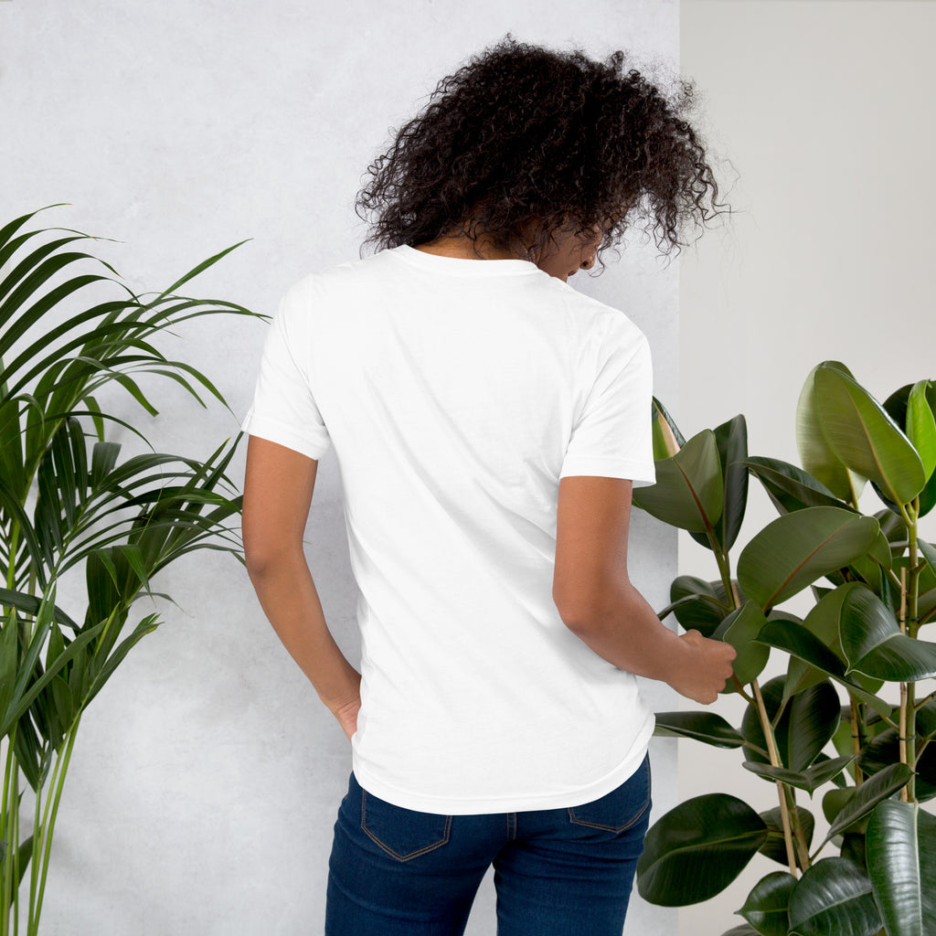 Unisex T shirt – Soft Cotton Casual Tee back view with plants in background, perfect for everyday wear.